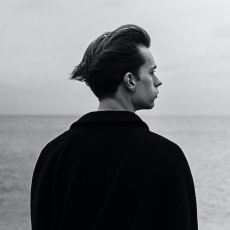 mans_back_at_sea
